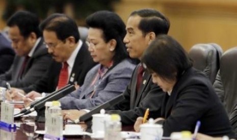 Indonesia's President Joko Widodo (second right) attends a meeting with China's President Xi Jinping (not pictured) at the Great Hall of the People in Beijing, November 9, 2014. 