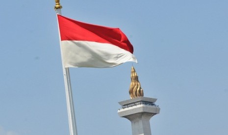 Indonesian flag with the National Monument in the background (illustration)