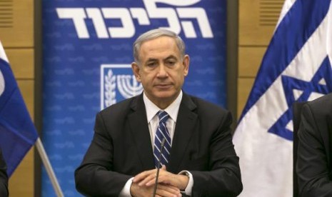 Israel's Prime Minister Benjamin Netanyahu attends a Likud party meeting at parliament in Jerusalem December 8, 2014.