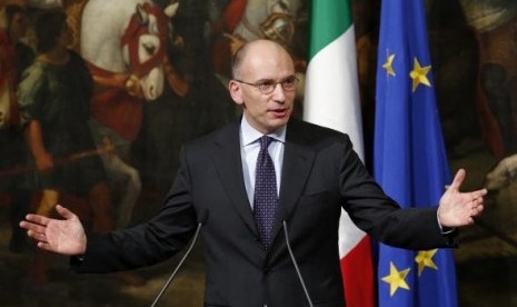 Italian Prime Minister Enrico Letta gestures during a news conference at Chigi Palace in Rome February 12, 2014.