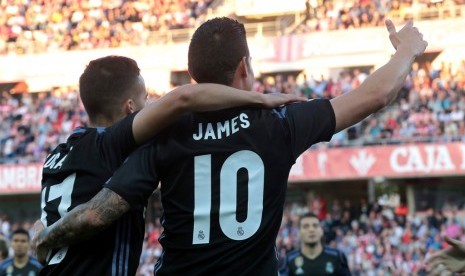 James Rodriguez merayakan golnya ke gawang Granada.