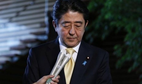 Japan's Prime Minister Shinzo Abe reacts as he speaks to the media at his official residence in Tokyo October 20, 2014.   