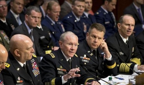 Joint Chiefs Chairman Gen. Martin Dempsey (center) testifies on Capitol Hill in Washington in June this year, before the Senate Armed Services Committee hearing investigating the growing epidemic of sexual assaults within the military. (file photo)