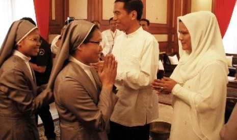 First Lady Iriana Widodo with President Jokowi