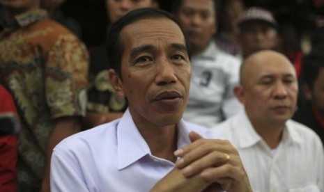 Joko Widodo looks on during PDIP party campaign in Jakarta March 16, 2014.