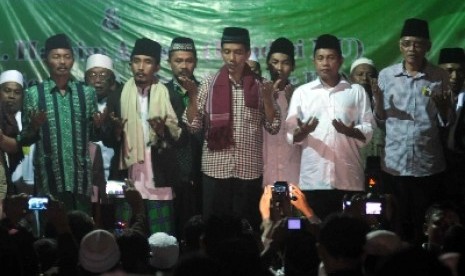 Jokowi ketika berjanji menetapkan 1 Muharram menjadi Hari Santri Nasional.