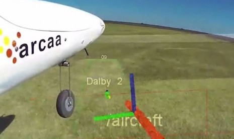 Kamera udara menunjukkan pendaratan pesawat tak berawak, dengan vektor computer mengkapling posisinya.