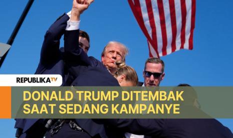 Kandidat presiden dari Partai Republik Donald Trump dikelilingi oleh agen Dinas Rahasia AS selepas tembakan padakampanye, Sabtu, 13 Juli 2024, di Butler, Pennsylvania.