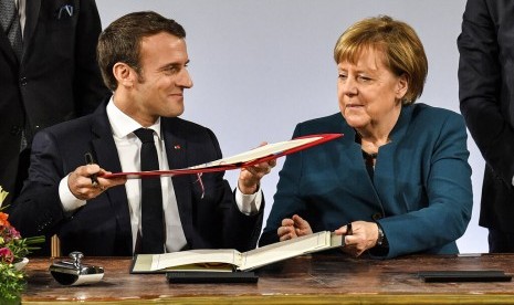 Kanselir Jerman Angela Merkel dan Presiden Prancis Emmanuel Macron.