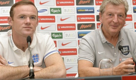 Wayne Rooney bersama pelatih Timnas Inggris Roy Hodgson.