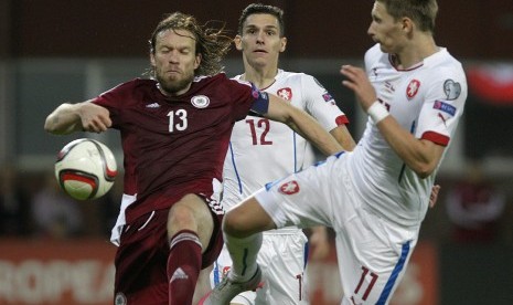 Kaspars Gorkss (L) of Latvia and David Pavelka (C) and Milan Skoda of Czech Republic during UEFA Euro 2016 qualifying match between Latvia and Czech Republic in Riga, Latvia, 06 September 2015. 