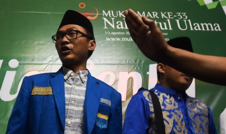  Ketua PMII Aminuddin Maruf menjawab pertanyaan wartawan terkait keputusan Sidang komisi orginasisi pada Muktamar ke-33 NU di Jombang, Jawa Timur, Selasa (4/8).