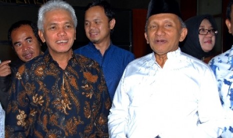 Ketua Umum PAN Hatta Rajasa (kiri) dan Dewan Pembina Amien Rais (kanan).