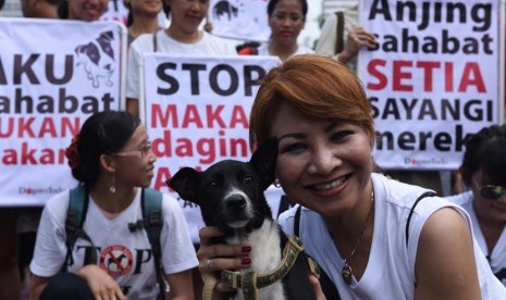 Komunitas pecinta anjing DogsterIndo melakukan aksi Stop Konsumsi Daging Anjing.