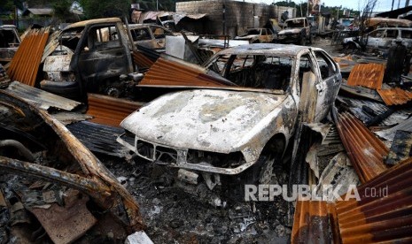 Kondisi pertokoan dan rumah warga yang hagus terbakar di Entrop, Kota Jayapura, Papua, Ahad (1/9/2019).