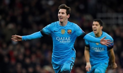 Lionel Messi merayakan golnya ke gawang Arsenal.