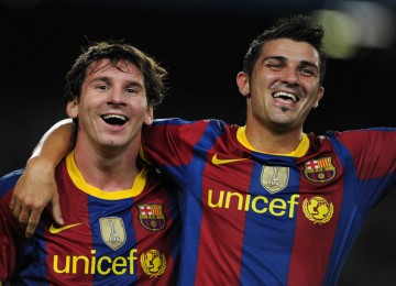 Lionel Messi (kiri) dan David Villa