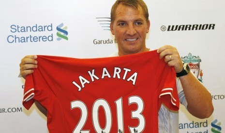 Liverpool's manager Brendan Rodgers holds a jersey during a press conference in Jakarta, Indonesia, Thursday, July 18, 2013. Liverpool is on the 2013 summer tour to Indonesia, Australia and Thailand.