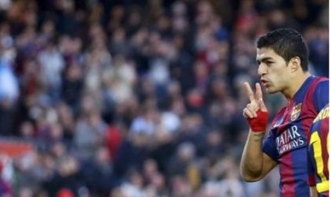 Luis Suarez saat merayakan golnya untuk Barcelona.