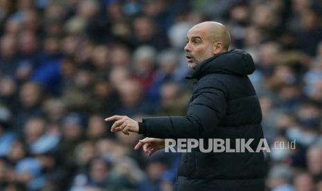 Pelatih Manchester City Pep Guardiola. Guardiola menyebut Boxing Day tahun 2021 sangat seru lantaran tercipta gol yang banyak dalam satu hari penyelenggaraan.