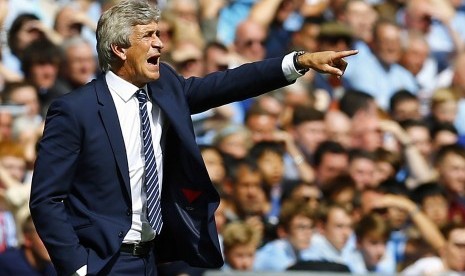 Manchester City manager Manuel Pellegrini reacts during their English Community Shield soccer match against Arsenal at Wembley Stadium in London, August 10, 2014. 