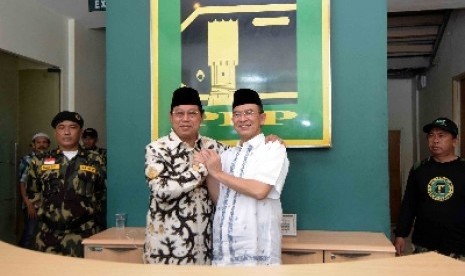 Mantan ketua umum PPP Suryadharma Ali (kanan) bersama Ketua Umum PPP Djan Faridz (kiri).