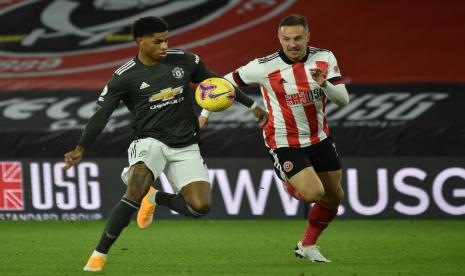 Marcus Rashford (kiri) mencetak dua gol dalam kemenangan Manchester United 3-1 atas Sheffield United di Liga Primer Inggris, JUmat (18/12) dini hari WIB.