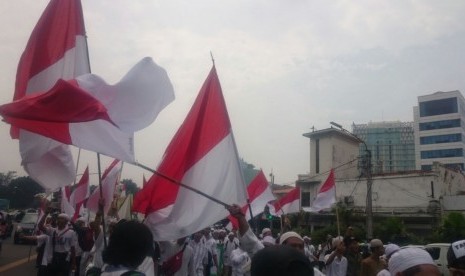 Massa Aksi Bela Islam berjalan menuju Masjid Istiqlal, saat aksi 411 lalu. 