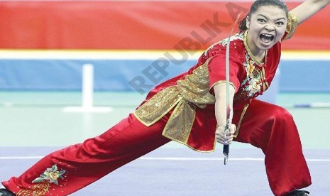 Medali Pertama.Atlet wushu Juwita  Niza Wasni menyumbangkan medali pertama bagi kontingen indonesiadi arena Asian Games 2014 Incheon ,Korea Selatan, Sabtu (20/9).