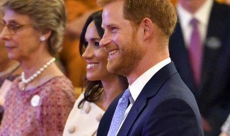 Meghan Markle dan Pangeran Harry dalam acara The Young Leaders Reception di Istana Buckingham di London, 26 Juni 2018.