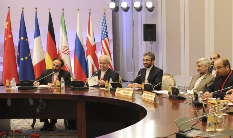 Members of the Iranian delegation, led by Supreme National Security Council Secretary and chief nuclear negotiator Saeed Jalili (second right), sit at a table during talks in Almaty, on Tuesday.  