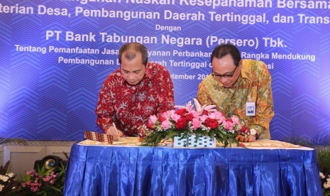 Menteri Desa PDTT Marwan Jafar saat MoU dengan Direktur Utama BTN Maryono.