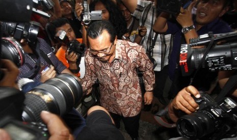  Menteri Pertanian Suswono memenuhi panggilan pemeriksaan di Gedung Komisi Pemberantasan Korupsi (KPK), Jakarta, Senin (18/2).  (Republika/Adhi Wicaksono)