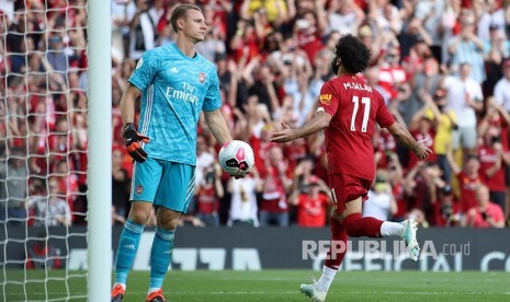 Mohamed Salah merayakan gol pada laga Liga Inggris di Stadion Anfield, Liverpool, Ahad dinihari (24/8).