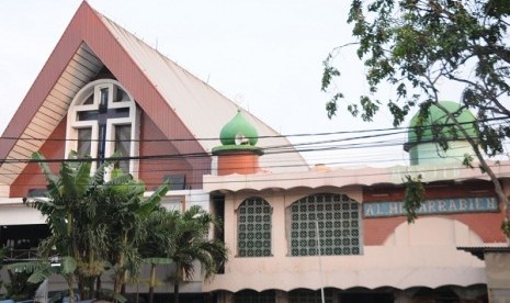 Mosque Al Muqarrabien (right) is built side by side with a Church Masehi Injili Sangihe Talaud in Tanjung Priuk,North Jakarta.    