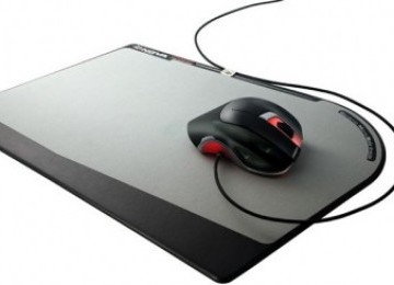 Mouse di atas mousepad (ilustrasi)