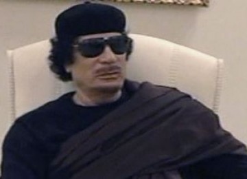 Muammar Qaddafi.