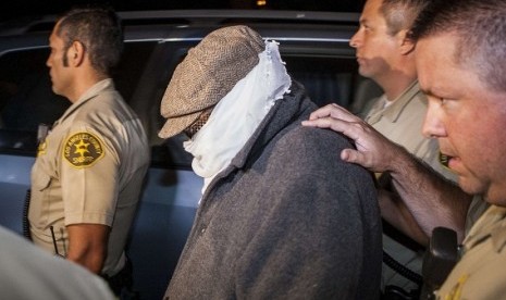 Nakoula Basseley Nakoula (center) is escorted out of his home by Los Angeles County Sheriff's officers in Cerritos, California in this file photo taken September 15, 2012. Nakoula, the man whose film 