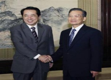 Naoto Kan (kanan) bertemu dengan Wen Jibao saat dia masih sebagai Menteri keuangan Jepang