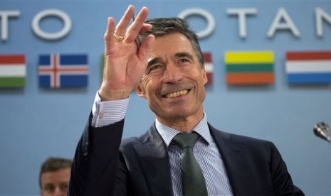 NATO Secretary General Anders Fogh Rasmussen gestures during a meeting of the North Atlantic Council at NATO headquarters in Brussels on Tuesday, April 1, 2014. 