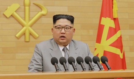 North Korean leader Kim Jong Un delivers his New Year's speech at an undisclosed place in North Korea Monday, Jan. 1, 2018. 