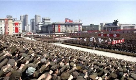 North Koreans including soldiers attend a rally in support of North Korean leader Kim Jong-un's order to put its missile units on standby in preparation for a possible war against the US and South Korea, in Pyongyang, March 29, 2013.