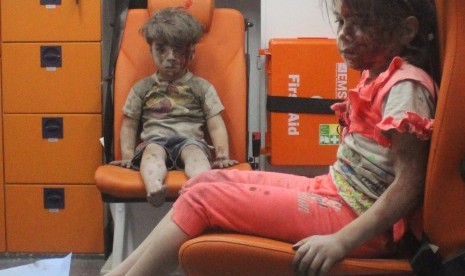  Five years old Omran Daqneeshdarah with his sister in an ambulance. They were saved from a building after airstrike in Syrian city of Aleppo