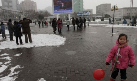 On a large television screen in front of Pyongyang's railway station, a North Korean state television broadcaster announces the news that North Korea conducted a nuclear test on Tuesday, Feb. 12, 2013. 