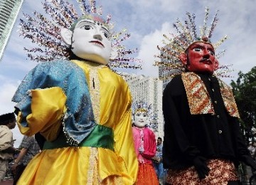 Ondel-ondel is traditional puppet in Betawi culture or Jakarta today (illustration). 