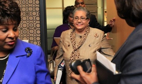 Outgoing schools superintendent, Dr. Beverly Hall (center), arrives for her last Atlanta school board meeting at the Atlanta Public Schools headquarters in Atlanta. Hall and nearly three dozen other administrators, teachers, principals and other educators 