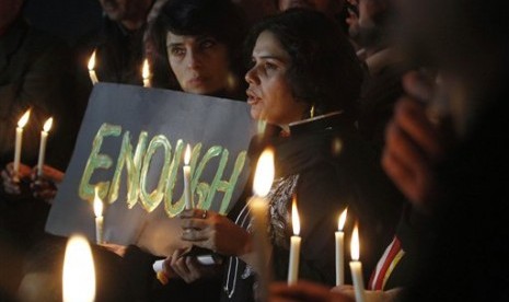 Pakistani civil society members take part in a candle light vigil for the victims of a school attacked by the Taliban in Peshawar, Tuesday, Dec. 16, 2014 in Islamabad, Pakistan. 