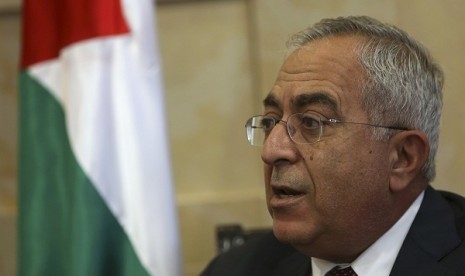 Palestinian Prime Minister Salam Fayyad speaks during an interview with Reuters in the West Bank city of Ramallah December 17, 2012. He says that sanction imposed by Israel puts about a million citizens in Palestine in the cycle of poverty.  