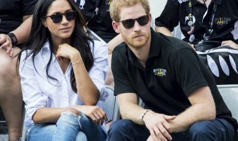 Pangeran Harry tengah bersama kekasihnya, Meghan Markle di acara Invictus Game.