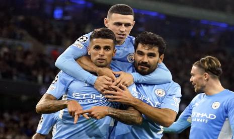 Para pemain Manchester City merayakan gol Joao Cancelo (kiri) ke gawang RB Leipzig.